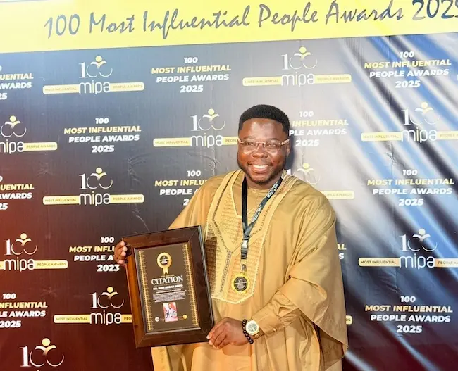 Dr. Kofi Brifo receiving the 100 Most Influential People award